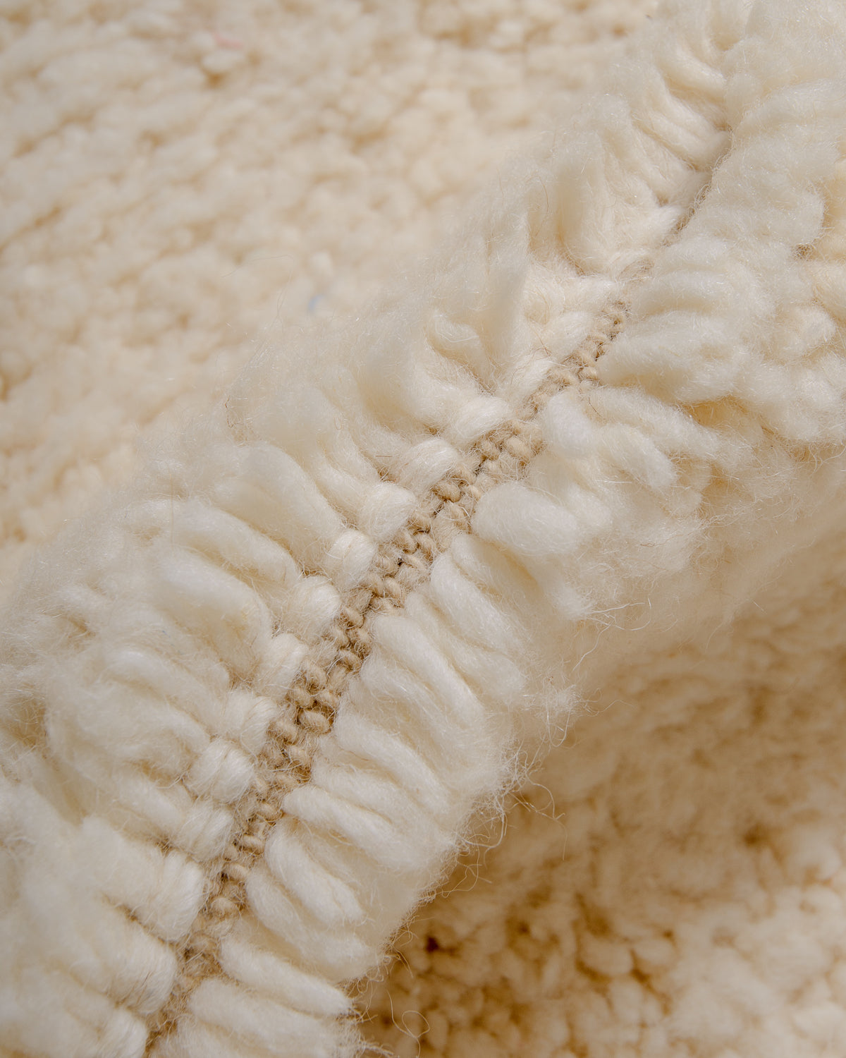 Modern, designer, handcrafted Berber rug from Morocco. Beniourain carpet with minimalist design, natural wool pile and a fluffy texture.